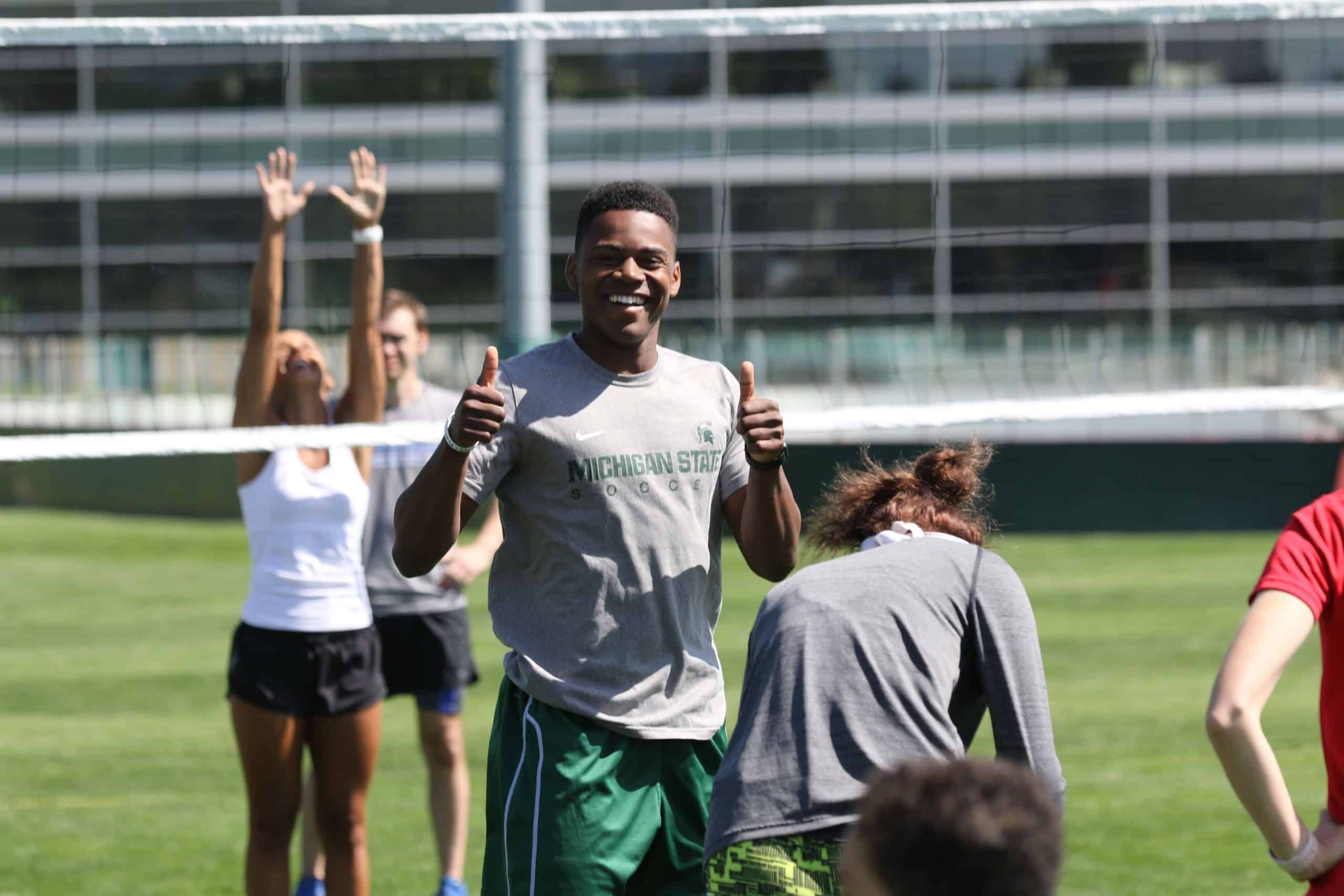 College freshman athletes together on campus