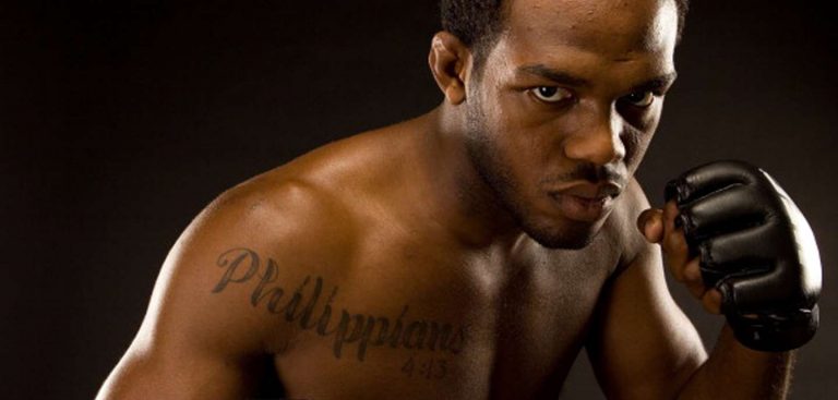 boxer with Phillipians 4:13 tattoo on his chest