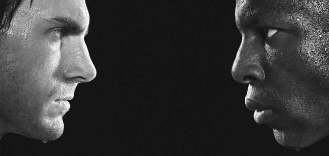 Black and white picture of two sweating people facing each other