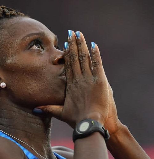 female athlete praying
