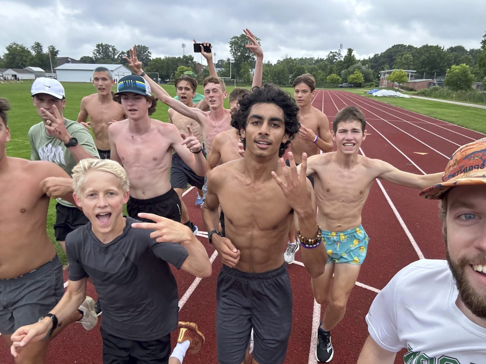 Cheering runners at a track camp