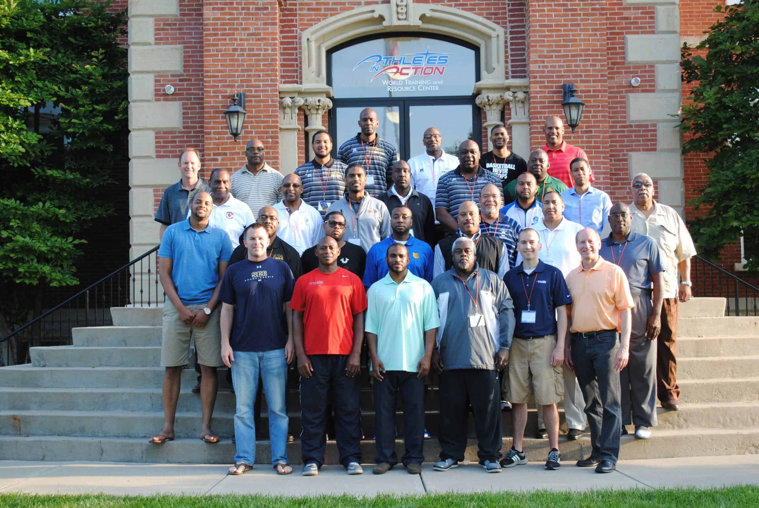 HBCU coaches standing in front of AIA building