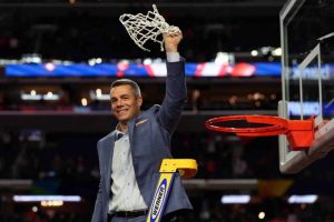 coach tony bennett cutting down the net