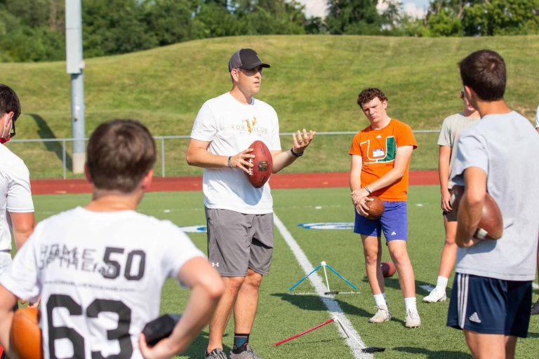 football coach instructing youth players
