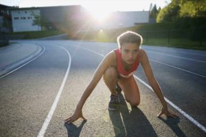 Focused female athlete on track
