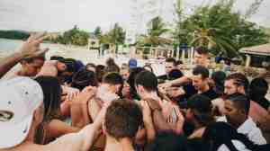 Group of athletes in prayer