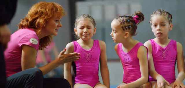 UR_challenge_of_letting_your_child_struggle woman comforting young gymnast