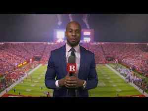 Shawn Tucker in front of an american football field
