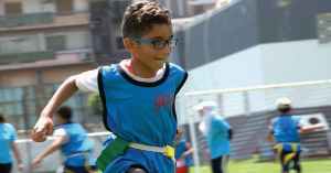young athletes play flag football