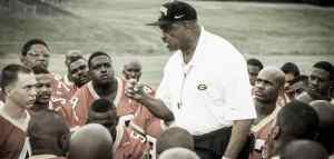 Old school picture of coach with american football team