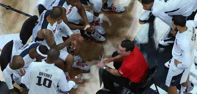 coach with basketball team