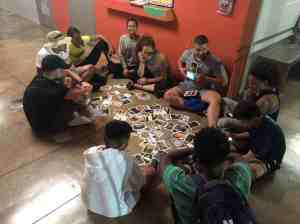 Student-athletes around a table sharing stories