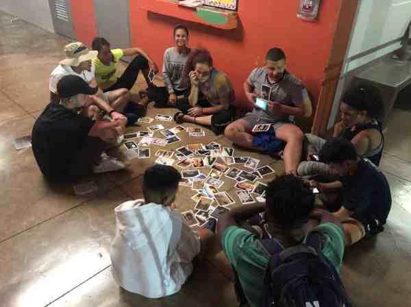Student-athletes around a table sharing stories