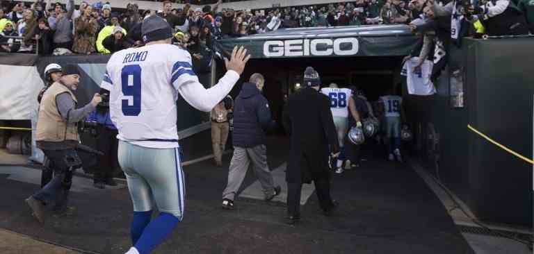 American football players leaving the field