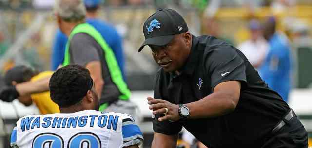 coach with american football player
