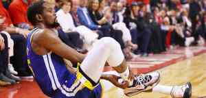 basketball player clutching his ankle