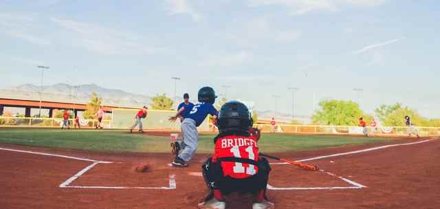 youth baseball. young umpire behind a player