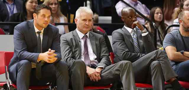 coaches sitting on sideline