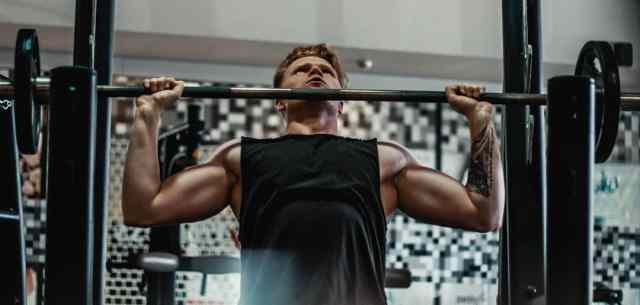 man lifting weights