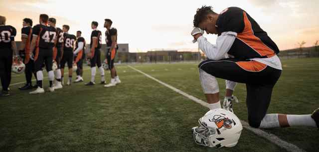 UR_only_believer_on_your_team american football athlete kneeling