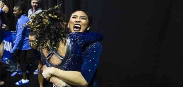 UR_perfection_in_sports3 Gymnast Peng Peng Lee embraces a teammate