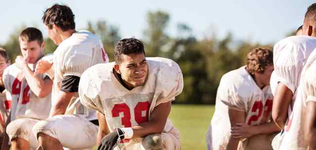 UR_why_team_jesus american football team with helmets off