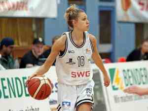 Women's Professional Basketball Player dribbling