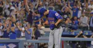 baseball player standing on field
