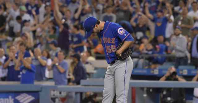 baseball player standing on field