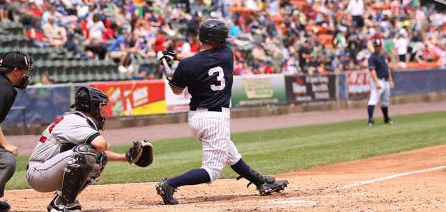 baseball player swinging