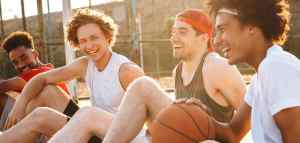 group of high school or college age basketball players sitting together