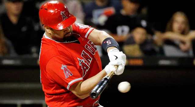 baseball player albert pujols swinging bat