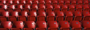 empty red stadium chairs