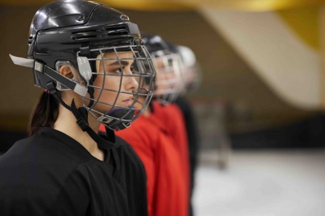 Female hockey player staring ahead