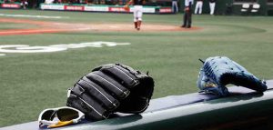 baseball gloves resting on bench