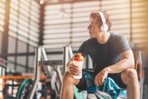 man resting in gym