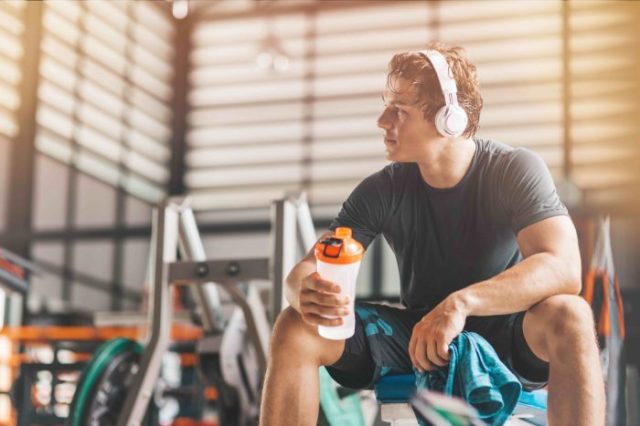 man resting in gym