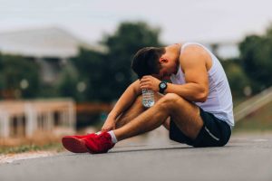 athlete resting with head down