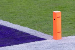 pylon in the end zone of an american football field