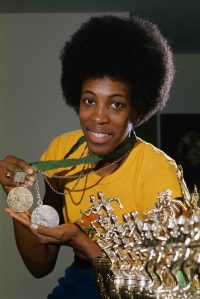 Madeline Manning Mims holds her Olympic gold medal from the '68 games in Mexico, and Olympic silver medal from the '72 games in Munich for the 800 meters