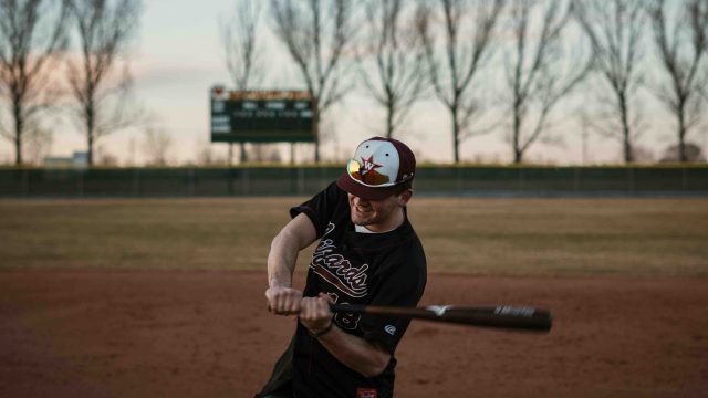 baseball player swinging bat