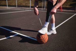 Athlete tying shoe