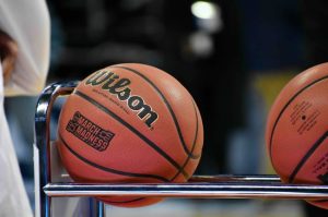 basketballs resting on a rack