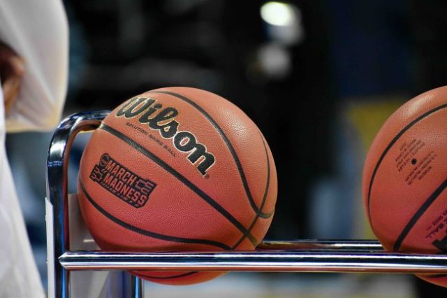 basketballs resting on a rack