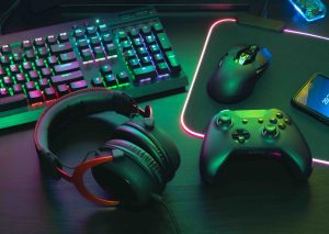 glowing headphones and computer keyboard with computer mouse