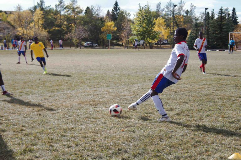 athletes playing soccer