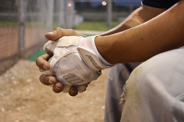 taped hands of seated athlete