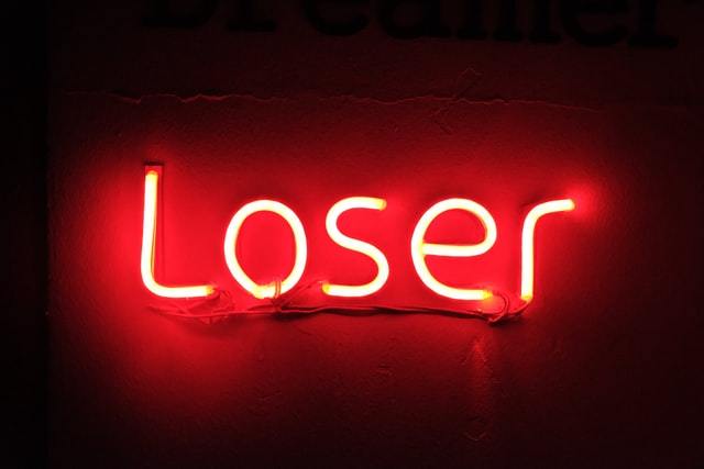 Neon sign says "Loser"