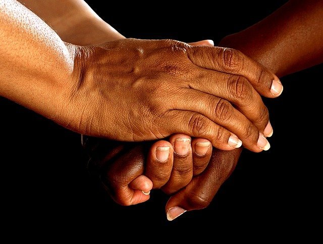 hands holding onto each other