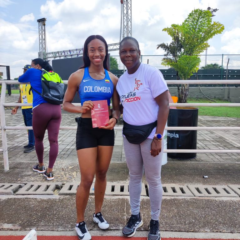 Colombian athlete and chaplain with Bible